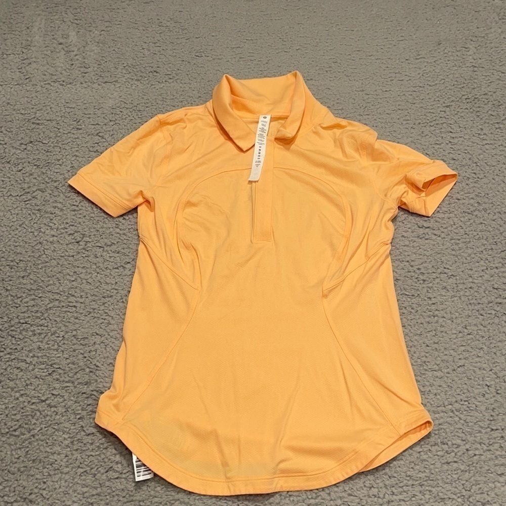 Lululemon Quick-Dry Short-Sleeve Polo Shirt
Sunny Coral size 2